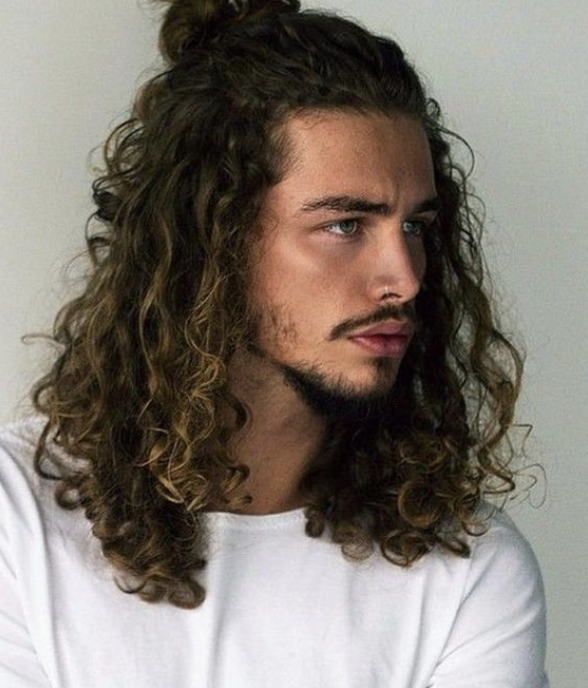 Half-up half-down curly hairstyle for men